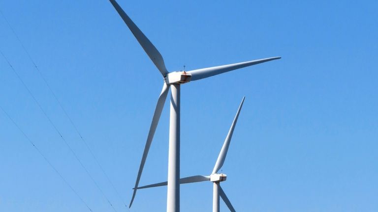 Land-based wind turbines spin in Atlantic City, N.J., April 28,...