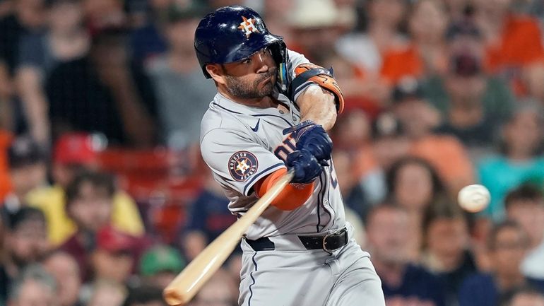 Houston Astros' Jose Altuve hits a two-run home run during...