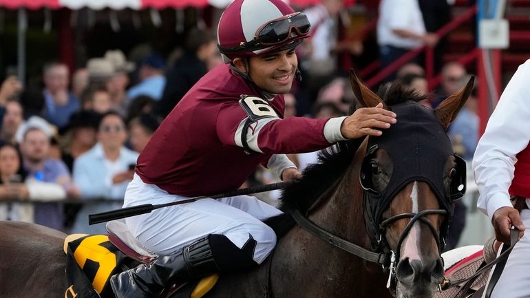 Jockey Luis Saez congratulates Dornoch (6) after winning the 156th...