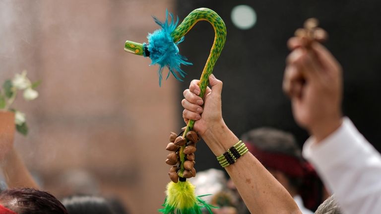 Residents and members of an Amaxac Indigenous organization hold an...