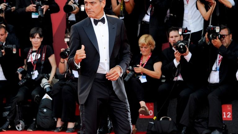 US actor George Clooney arrives on the red carpet for...