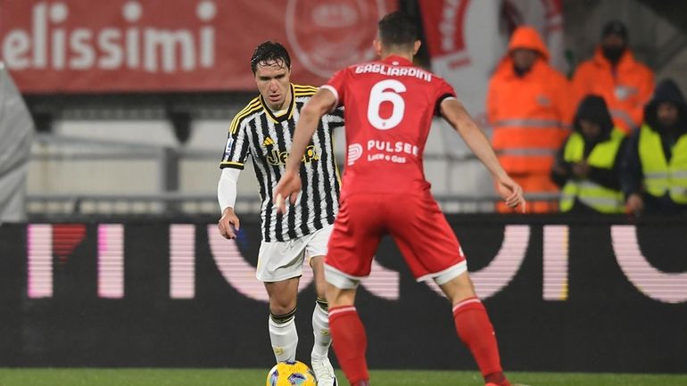 Juventus' Federico Chiesa takes on Monza's Roberto Gagliardini during the...