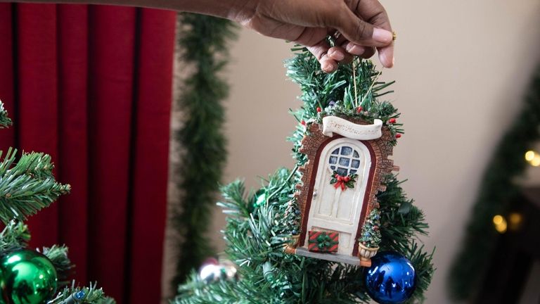 The Vitullo family, of Valley Stream, with the ornament that...