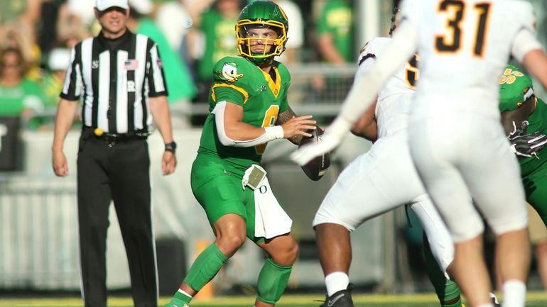 Oregon quarterback Dillon Gabriel (8) looks to pass during the...