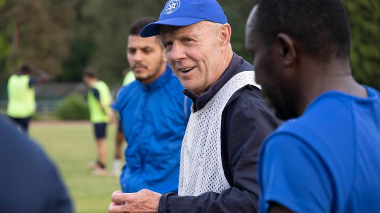 Makkabi Berlin coach Wolfgang Sandhowe gives instructions to his team...