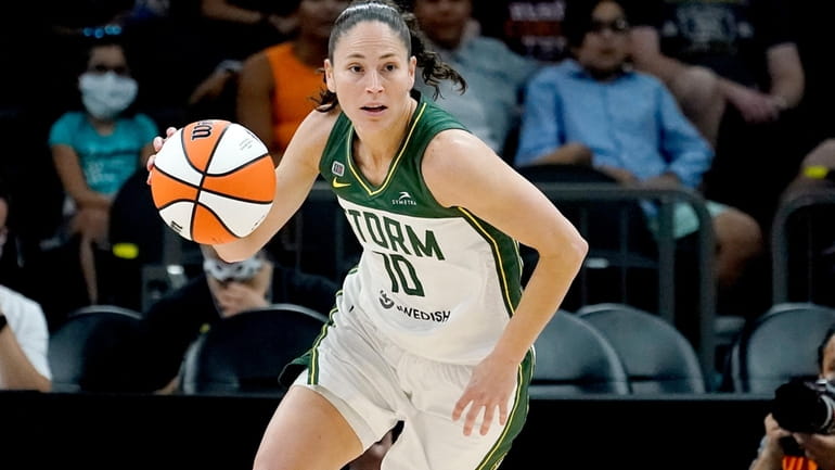 FILE - Seattle Storm guard Sue Bird (10) brings the...