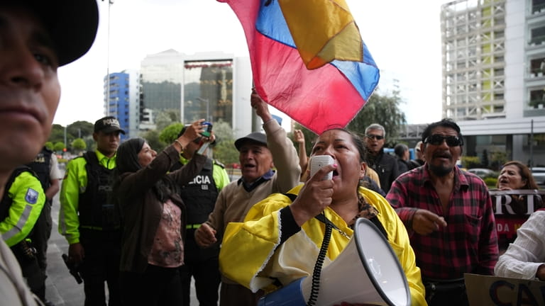 Supporters of the slain presidential candidate Fernando Villavicencio await the...