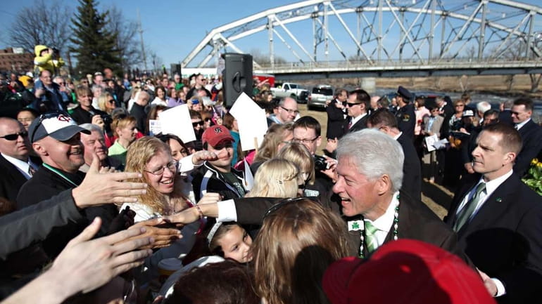 Former President Bill Clinton greets a crowd in Grand Forks,...