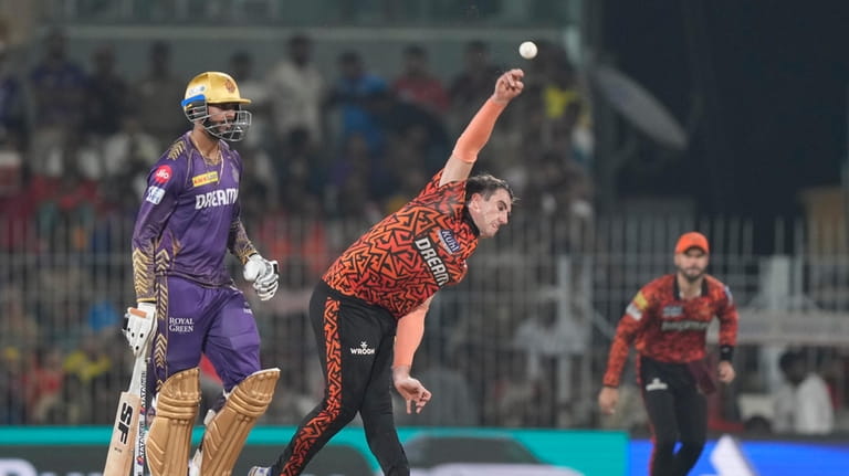 Sunrisers Hyderabad's captain Pat Cummins bowls a delivery during the...