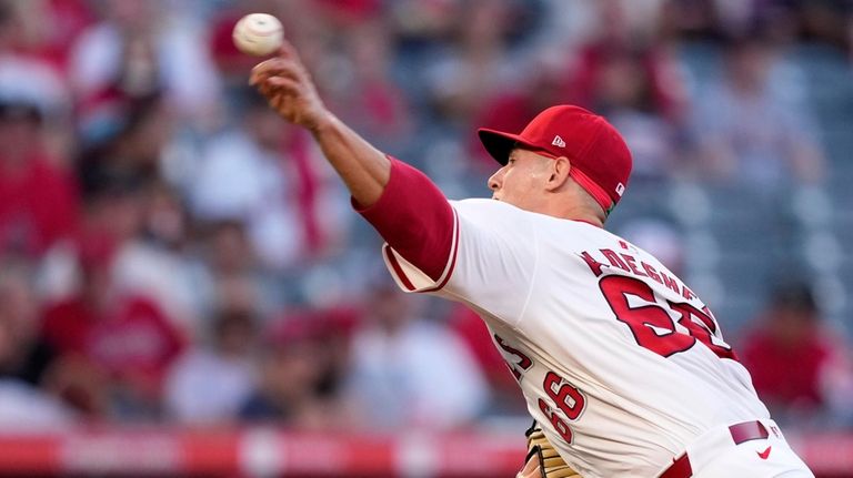 Los Angeles Angels starting pitcher Samuel Aldegheri throws to the...