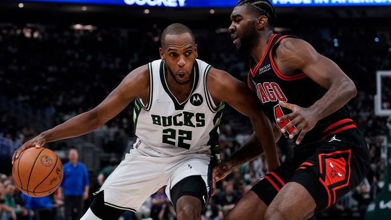 Milwaukee Bucks' Khris Middleton tries to get past Chicago Bulls'...