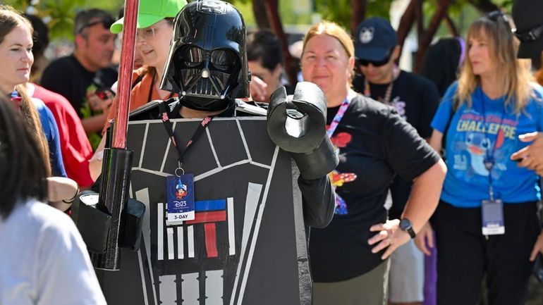 Andrea Feale is dressed as Lego Darth Vader as she...