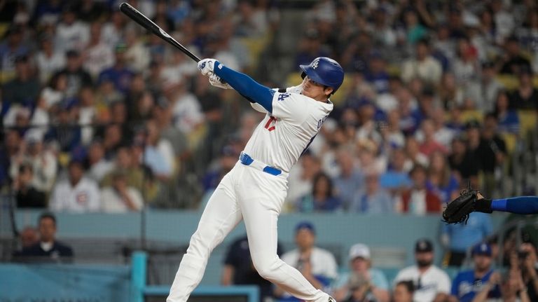 Los Angeles Dodgers designated hitter Shohei Ohtani (17) hits a...