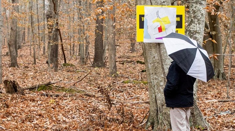 A man looks at a map after the ribbon-cutting ceremony...