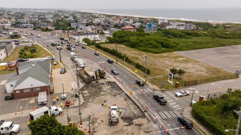 Construction crews repair the sinkhole on Lido Boulevard in Lido Beach...