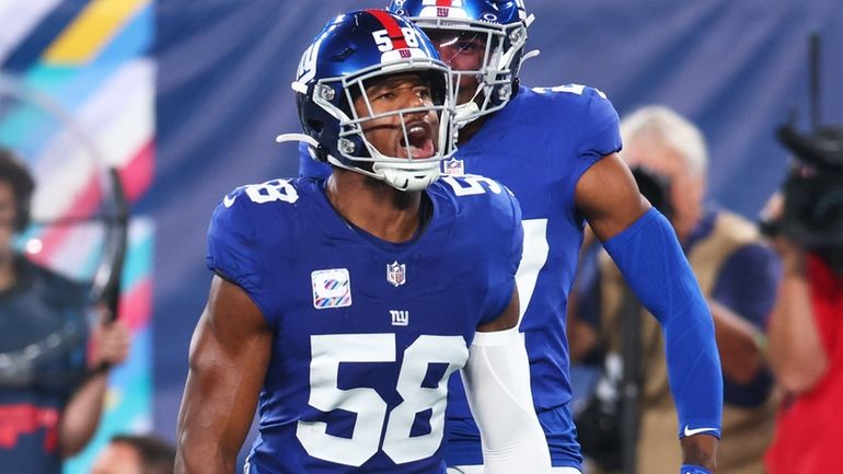 Bobby Okereke #58 of the New York Giants celebrates after...