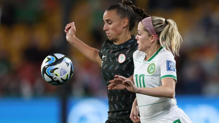 Nigeria's Ashleigh Plumptre, left, competes for the ball with Ireland's...