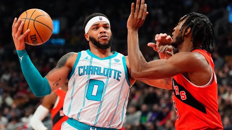 Charlotte Hornets forward Miles Bridges (0) drives upcourt as Toronto...