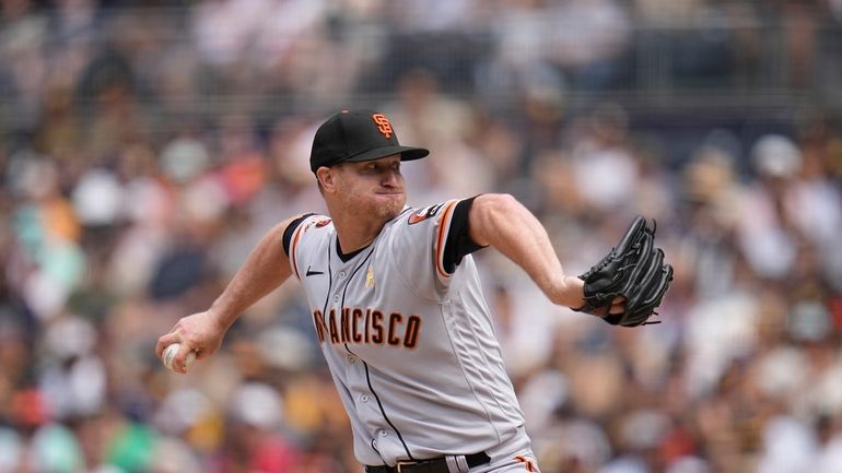 San Francisco Giants starting pitcher Alex Cobb works against a...