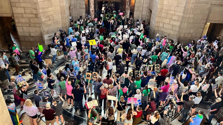 Hundreds of people gather at the Nebraska Capitol to protest...