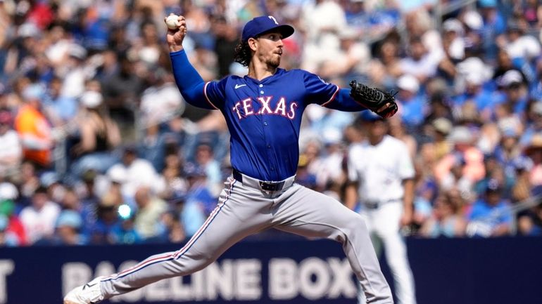 Texas Rangers pitcher Michael Lorenzen works against Toronto Blue Jays...