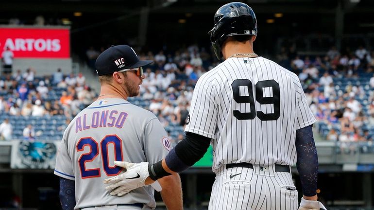 Aaron Judge of the Yankees stands at first base with Pete...