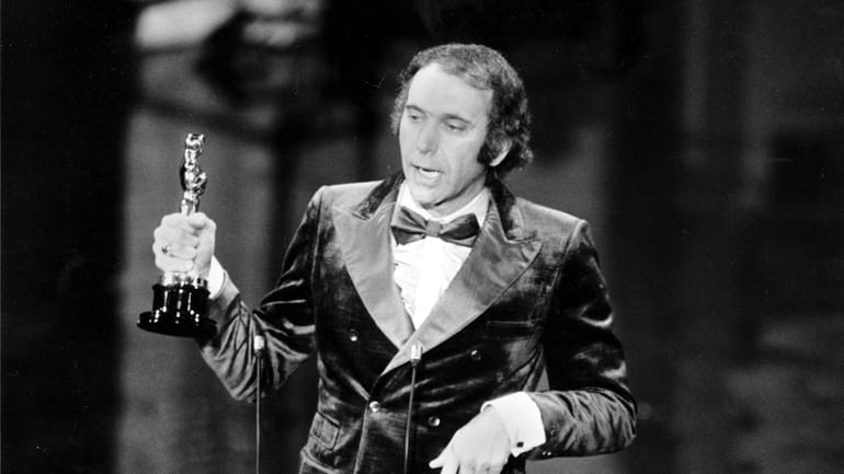 Producer Albert S. Ruddy accepts the Oscar for best picture...