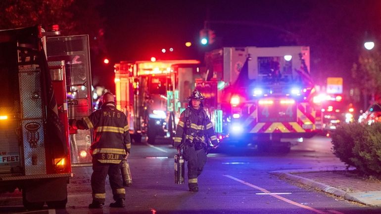 First responders Sunday night outside the Atria Park assisted living facility...