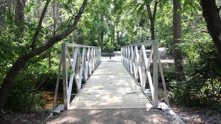 A new footbridge in Village of the Branch is part...