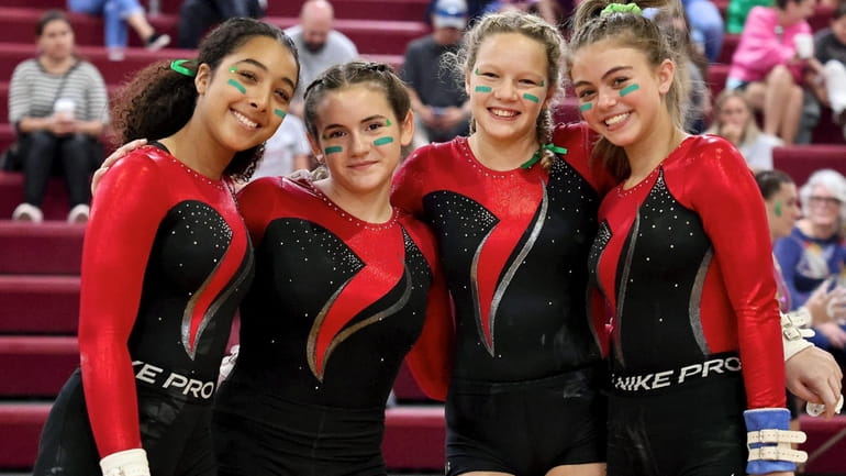Members of the Patchogue-Medford gymnastic squad pose for a photo...