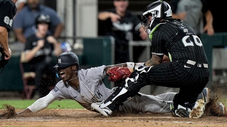 Jazz Chisholm Jr. of the Yankees scores a run during a...