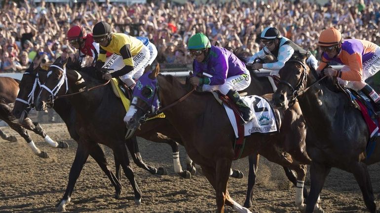 Losing jockey Victor Espinoza riding California Chrome at the 146th...