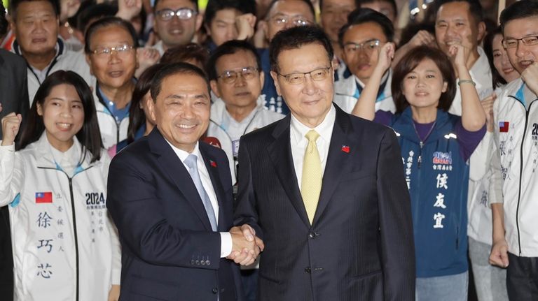 Taiwan's Nationalist Party presidential candidate Hou Yu-ih, center left, and...