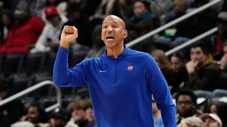 Detroit Pistons head coach Monty Williams signals from the sideline...