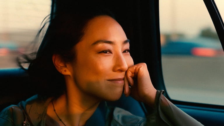 This image released by A24 shows Greta Lee in a...