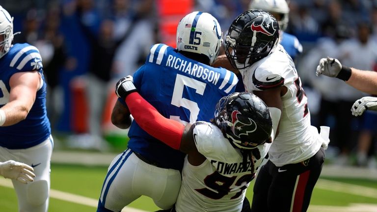 Indianapolis Colts quarterback Anthony Richardson (5) is sacked by Houston...