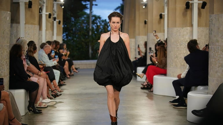 A model wears a creation by Louis Vuitton during a...