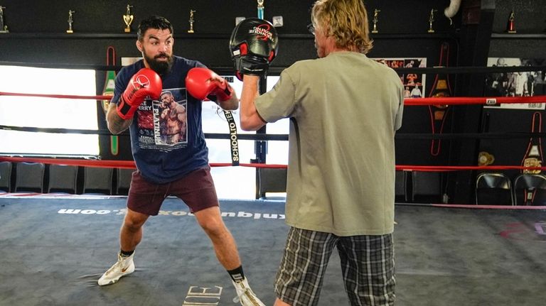 Mike Perry, left, a boxer, MMA fighter and now does...