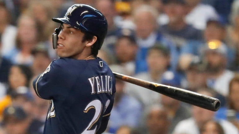 The Brewers' Christian Yelich hits a two-run home run during...