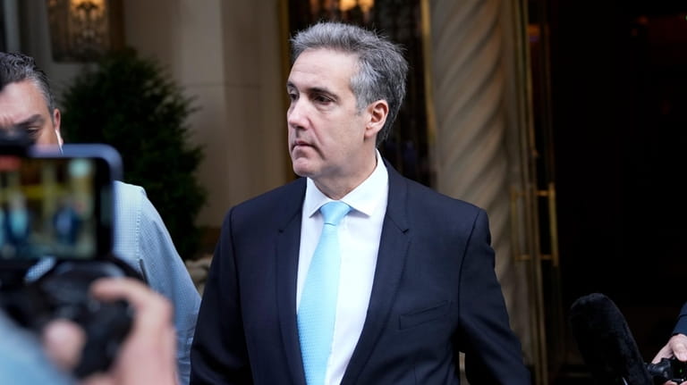 Michael Cohen leaves his apartment building in New York, Tuesday,...