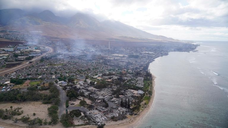 A wasteland of burned out homes and obliterated communities is...