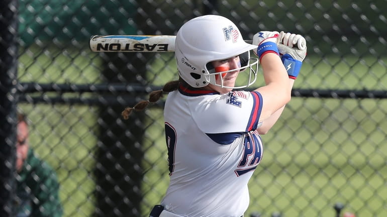 Miller Place's Emily Lopez (9) takes a swing in the...