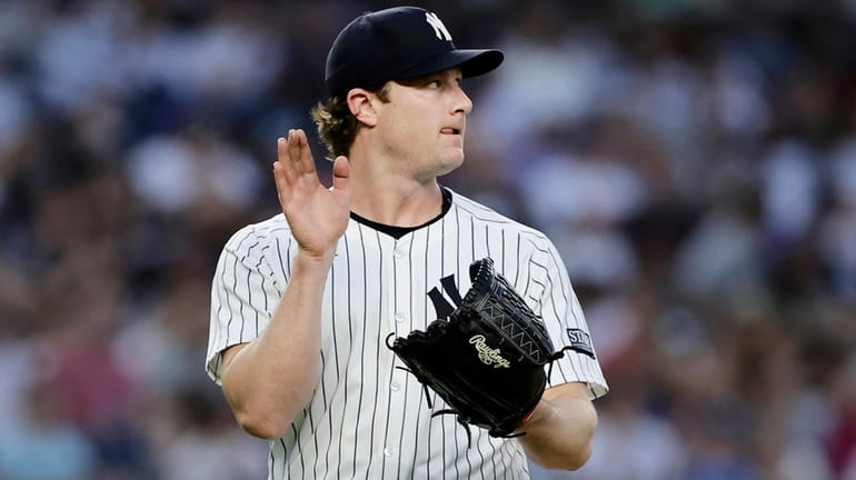 Gerrit Cole #45 of the Yankees reacts after the fourth inning...
