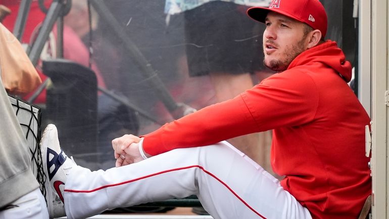 Los Angeles Angels center fielder Mike Trout sits in the...