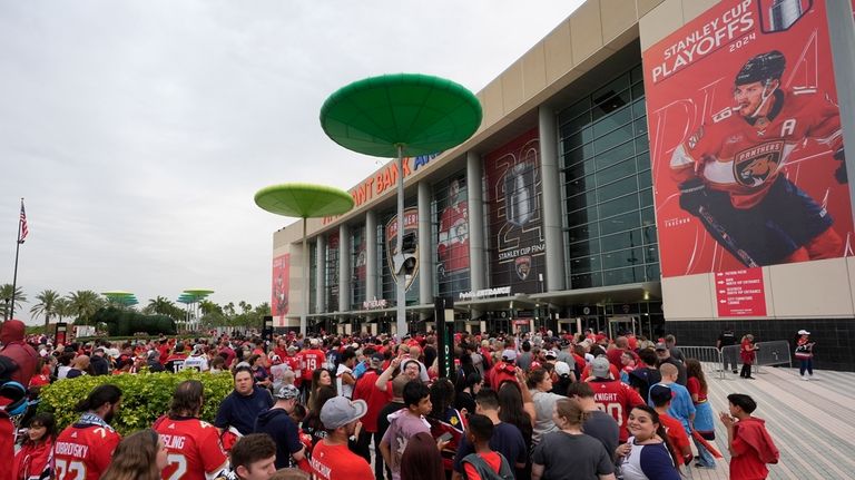 FILE -Fans wait in line to watch Game 4 of...