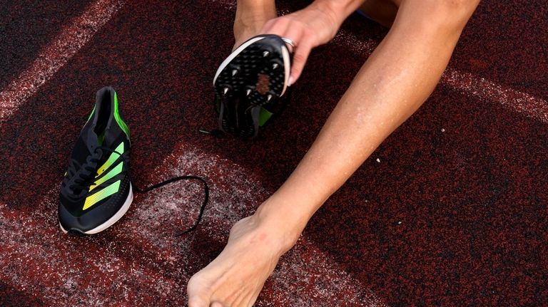 Italy's Valentina Petrillo wears her spiked shoes before training in...