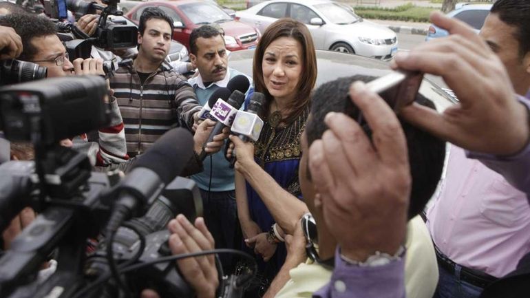 Egyptian first female presidential hopeful Bothaina Kamel is surrounded by...