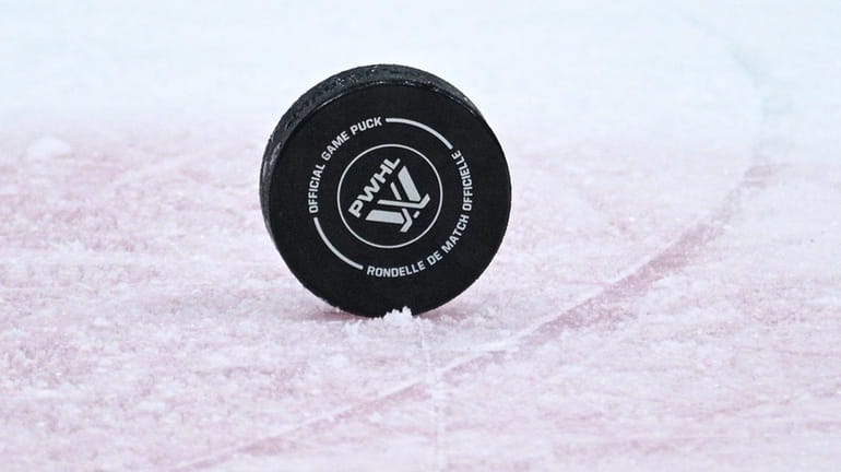 A puck is seen on the ice in the second...