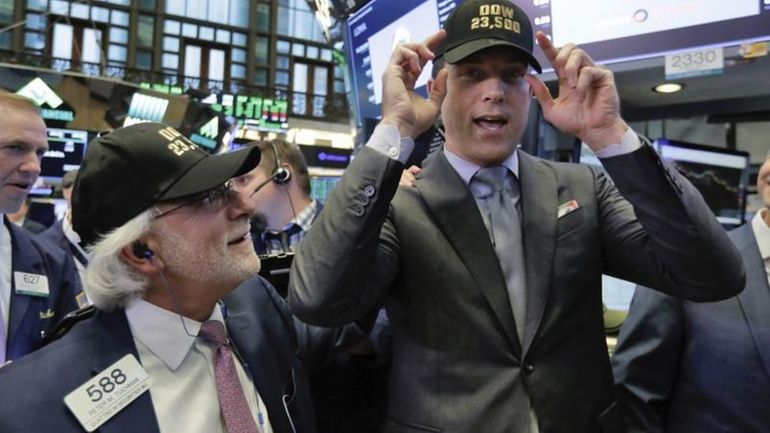 Trader Peter Tuchman, left, and New York Stock Exchange President...