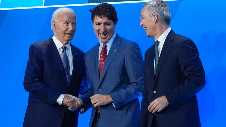 President Joe Biden and NATO Secretary General Jens Stoltenberg, right,...